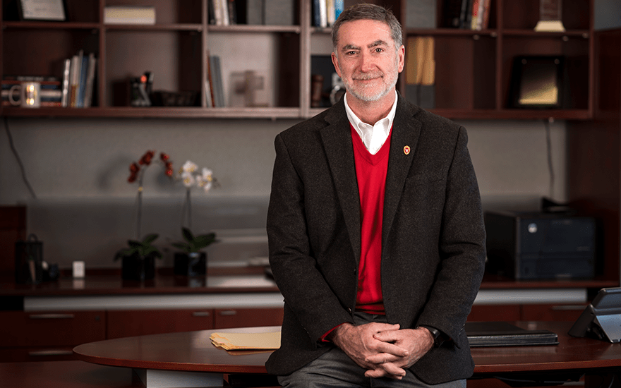 Barry Gerhart, Interim Albert O. Nicholas Dean, stands in his office