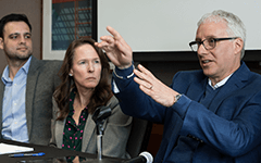 David Brancaccio sits beside two WSB faculty members for a discussion on corporate tax reform.