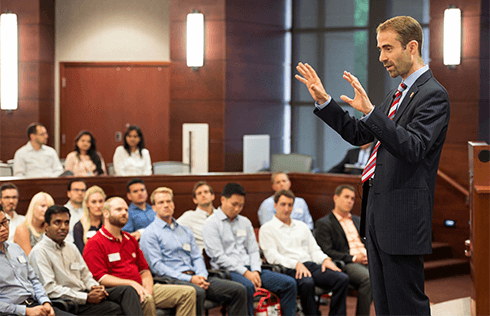 Dean Francois Ortalo-Magne speaks to MBA students