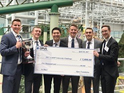 WSB students stand holding a giant check at the NAIOP University Challenge real estate case competition