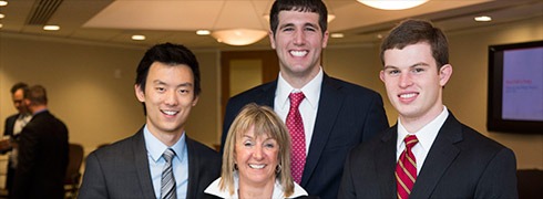 Wisconsin School of Business students, from left, Cong Xu, Nick Stender and Zachary Sikora won the Duff & Phelps YOUniversity Deal Challenge, a valuation competition in New York. Their faculty advisor was Senior Lecturer Belinda Mucklow, center.