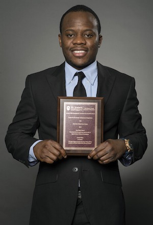 Adolph Okine holding Best Paper Award