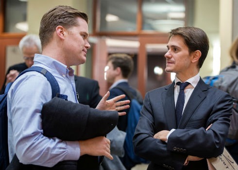 Student Ben Steven (MBA '17) talks with Assistant Professor Jaime Luque at the affordable housing event