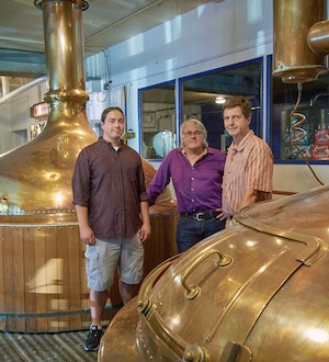 Professor Tom O'Guinn and MBA student Tim tour Capital Brewery with Richard King.