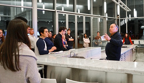 Jon Mckenzie speaks to a group of students