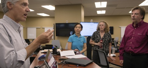 Paul Oliphant with ATW answers questions as he teaches faculty members how to use the new rooms, 2290-2294, on August 26, in Grainger Hall.