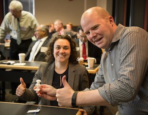 Natalie Rudolph and Enno Seimsen giving a thumbs up as he holds 3D printed Bucky