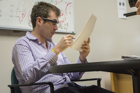 Ph.D. candidate Adam Spencer uses Google Glass to record feedback.
