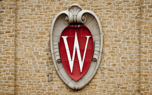 UW-Madison crest on a brick wall