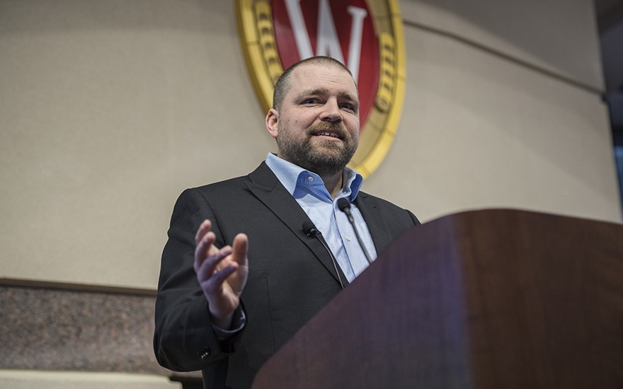 Seth Partnow speaks from the podium in the Plenary Room