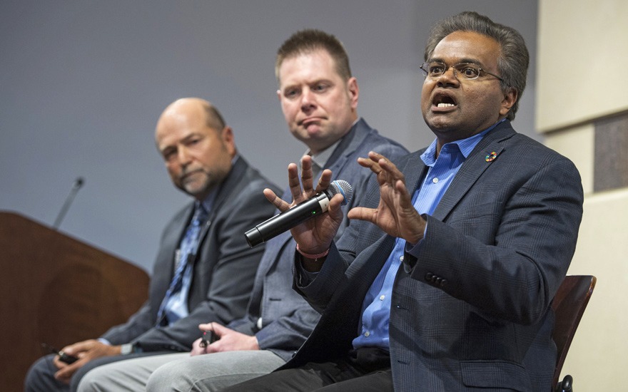 Three panel speakers present on a stage