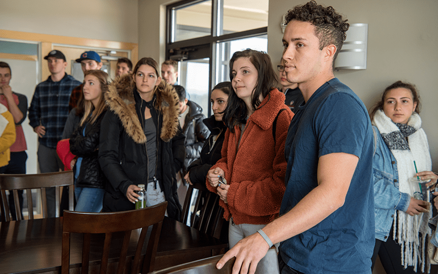 A group of students listening to someone off camera