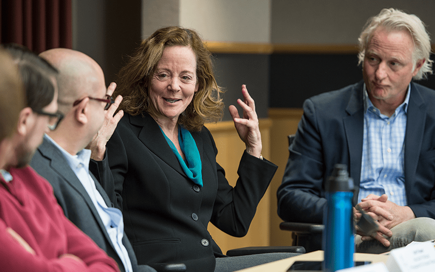 Joann Peck in a discussion during a faculty panel