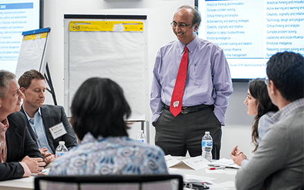 Dean Samba interacts with WSB alumni at a board meeting.