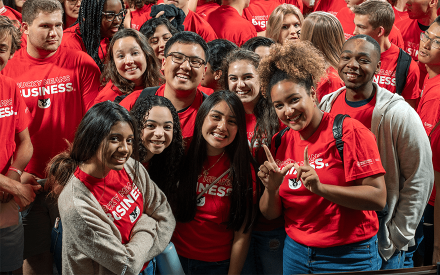 First-year students pose for a picture while making the "W" for UW-Madison