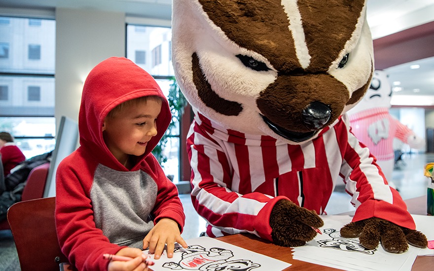 Bucky Badger coloring with a child