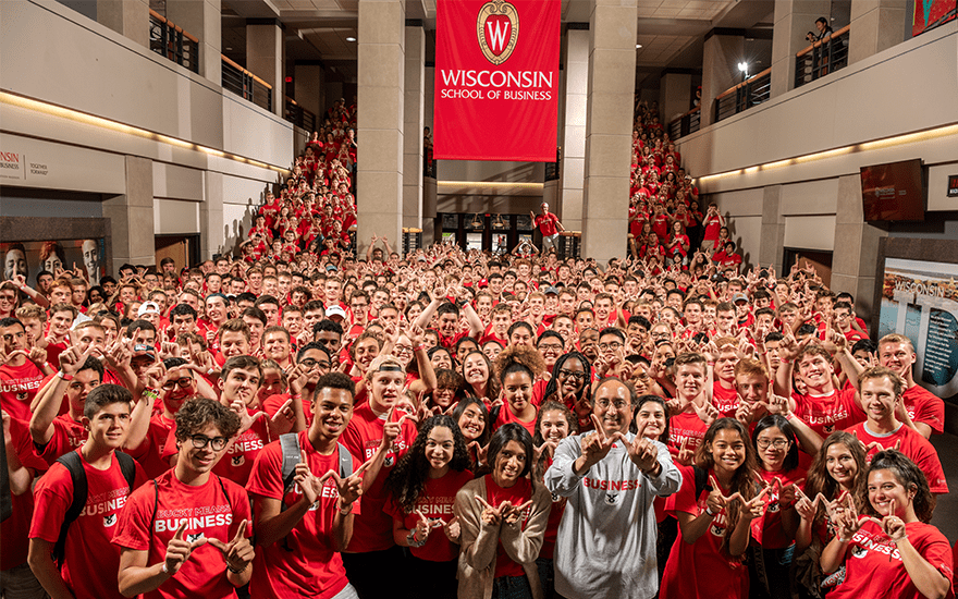 Dean Sambamurthy stands among 500 incoming undergraduate students in red t-shirts