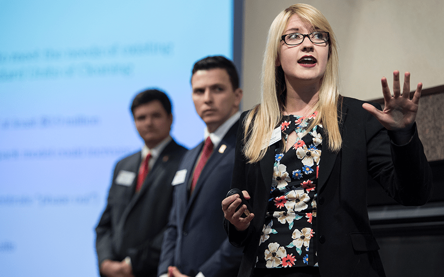 Wisconsin MBA students present on a stage