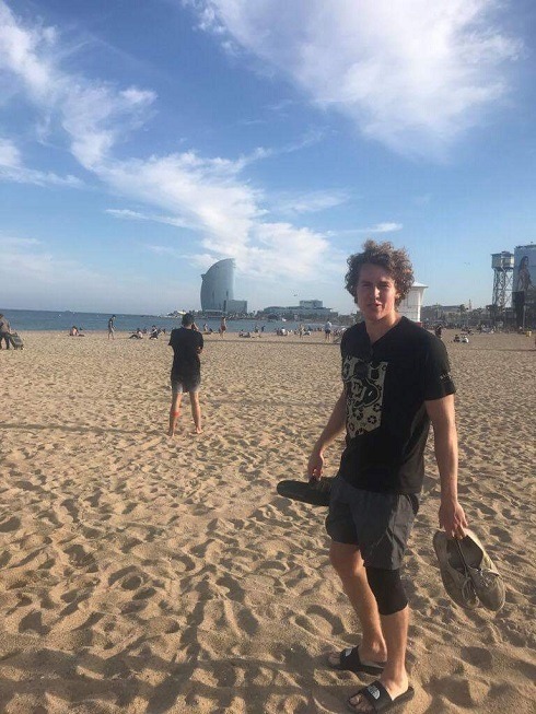 Nicholas Kizewski on beach in Barcelona