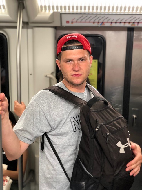 A man holding his backpack in front as a frontpack