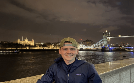 Student standing near River Thames in London, England