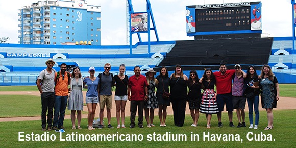 A group of people standing in a stadium in Cuba