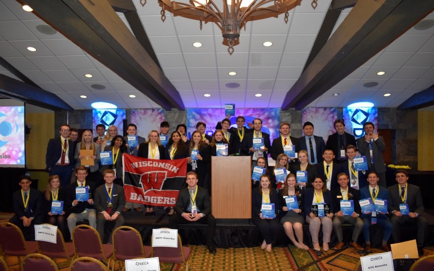 DECA students at the State Conference with medals and awards.