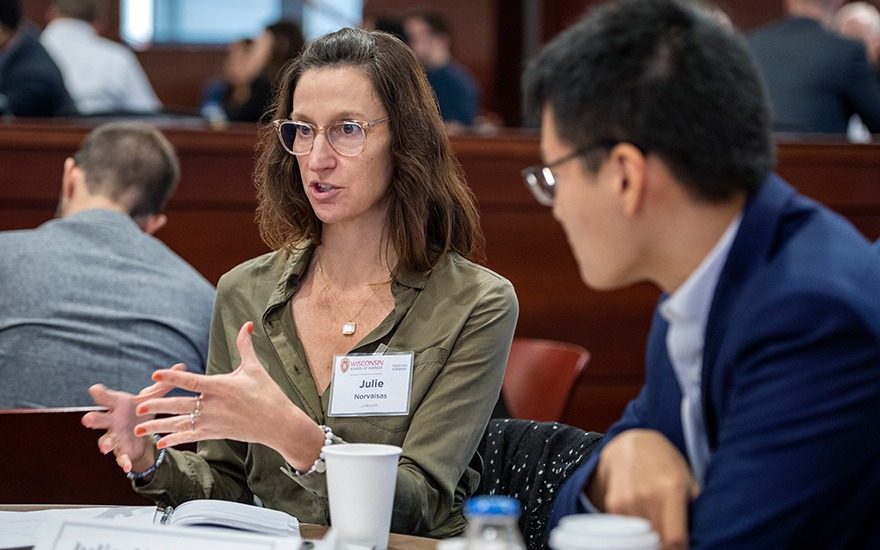 Julie Norvaisas gestures while speaking to students