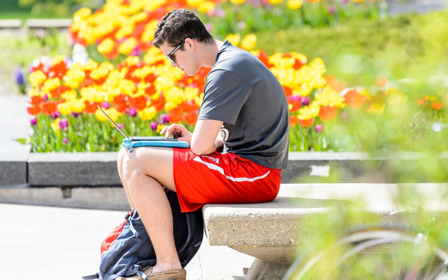 Student using a laptop outside