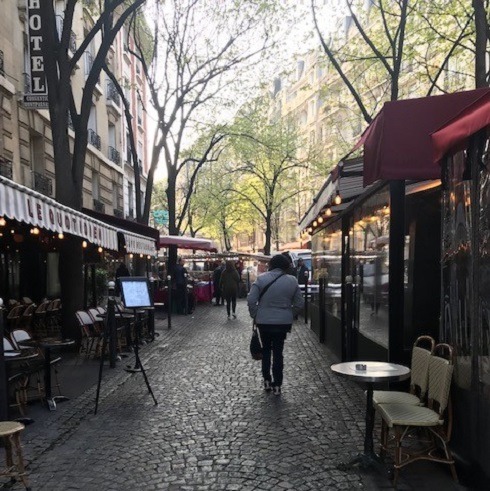 Cobblestone street lined with restaurants