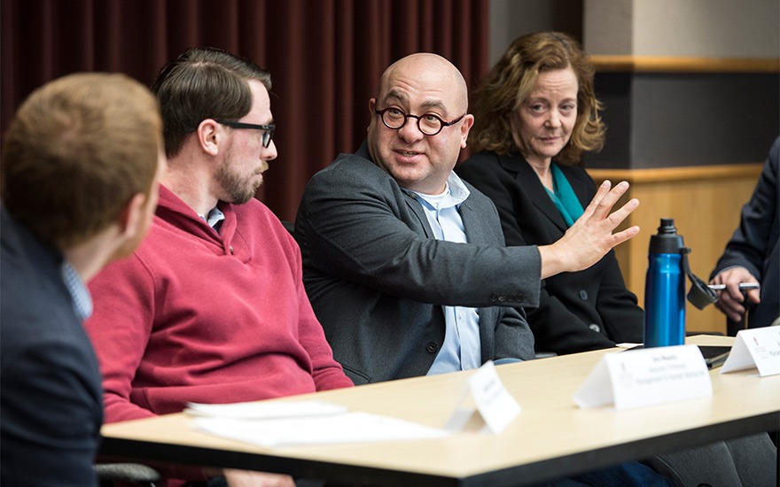 Hart Posen talking at a panel