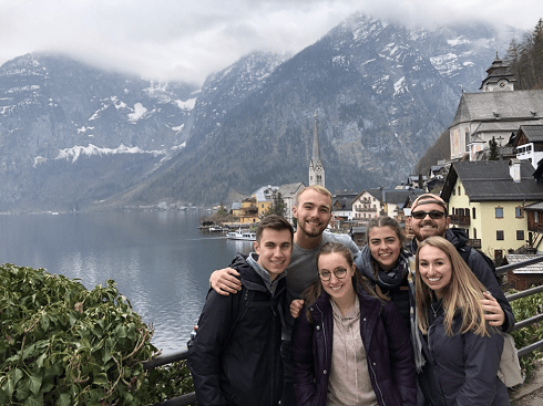 With friends and a snow capped mountain backdrop