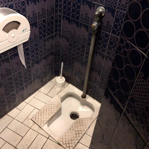 A squat toilet in a restaurant