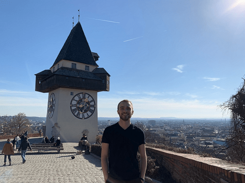 Me in front of a clock tower in Gratz, Austria