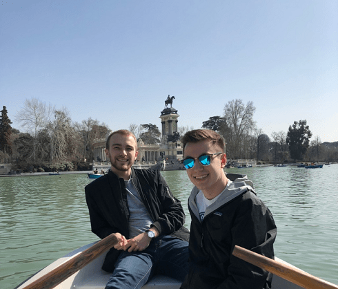 A friend and I in a row boat at El Retiro Park, Spain