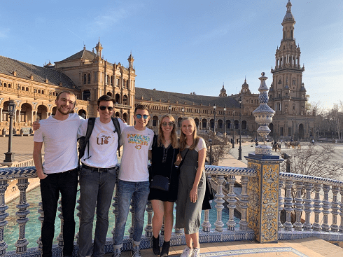 Friends in front of the Plaza de España in Spain