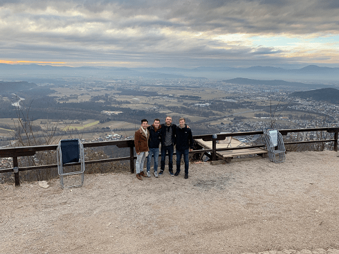 My friends and I in front of a landscape view of Ljubljana