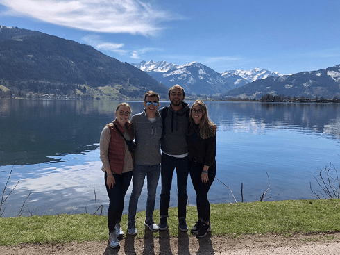 friends at a lake with mountain view