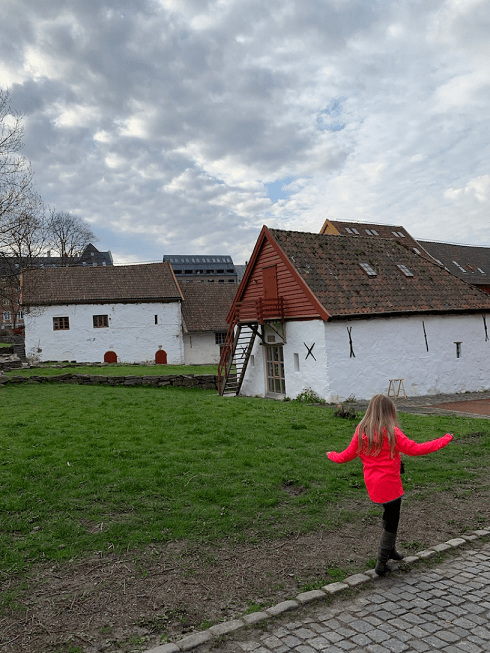 My sister walking on a cobblestone street