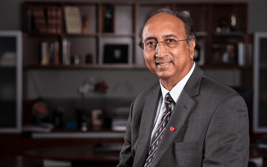 A portrait of WSB Dean Vallabh Sambamurthy in his office