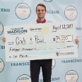 Jack Pawlik holding a giant check