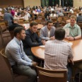 Students at a table at Wisconsin Entrepreneurship Showcase Event
