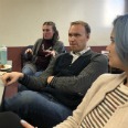 Three people seating at a table at Fellowship Seminar