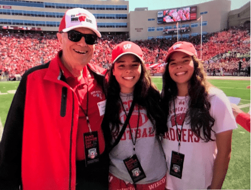 Nathan Brand at Badger Football game with granddaughters