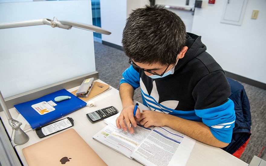 A male student studying for an exam