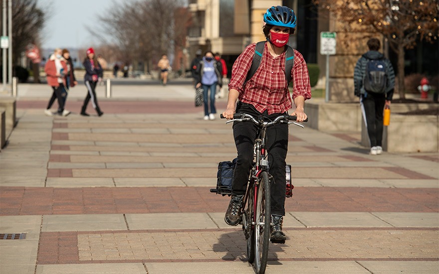 A student riding a bike