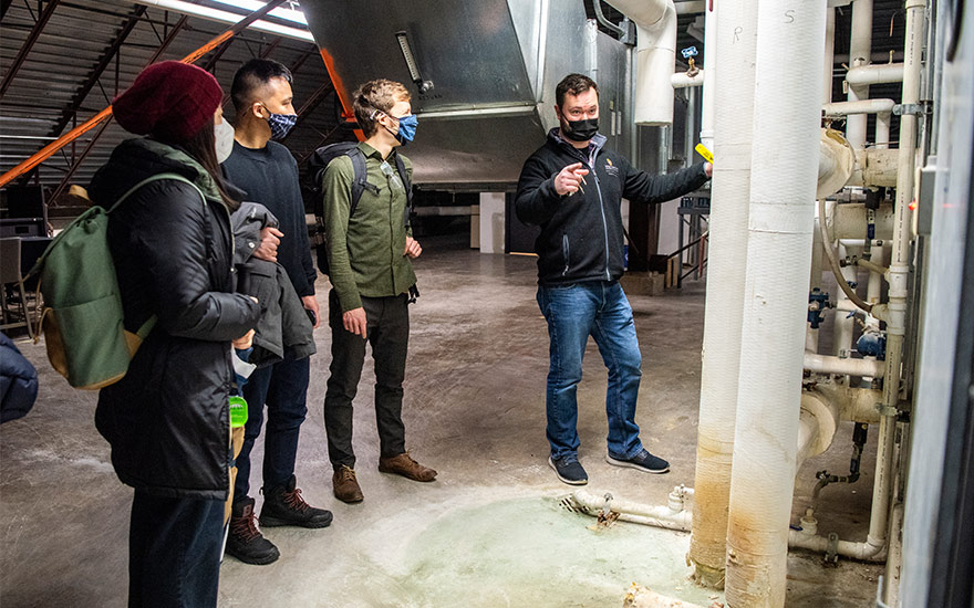 Tim Bent Jr. takes Wisconsin MBA students through Grainger Hall’s attic