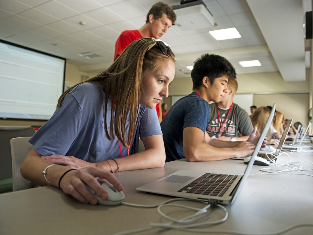 Students doing work on their laptops