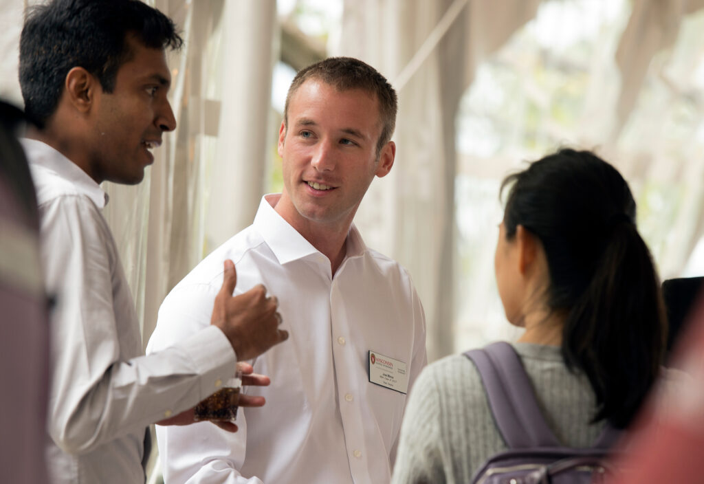 three students chatting at tour