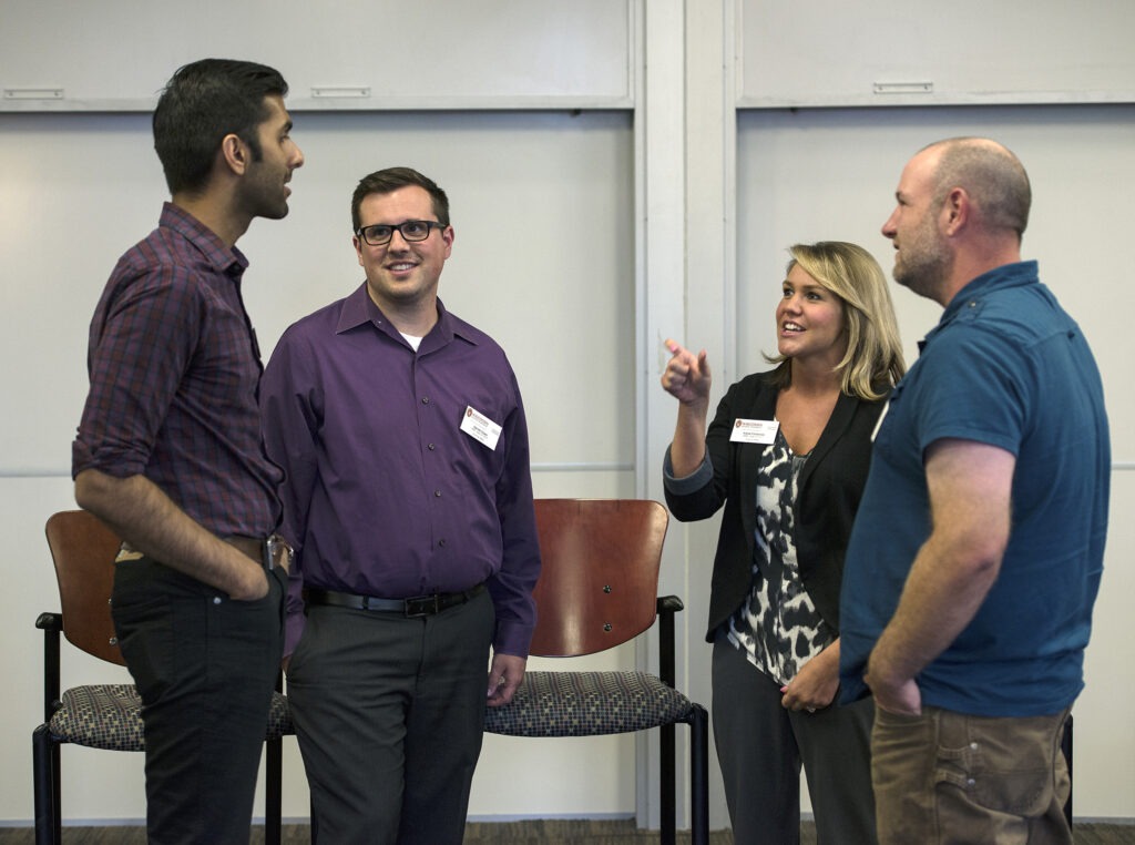 A group of MBA students talking